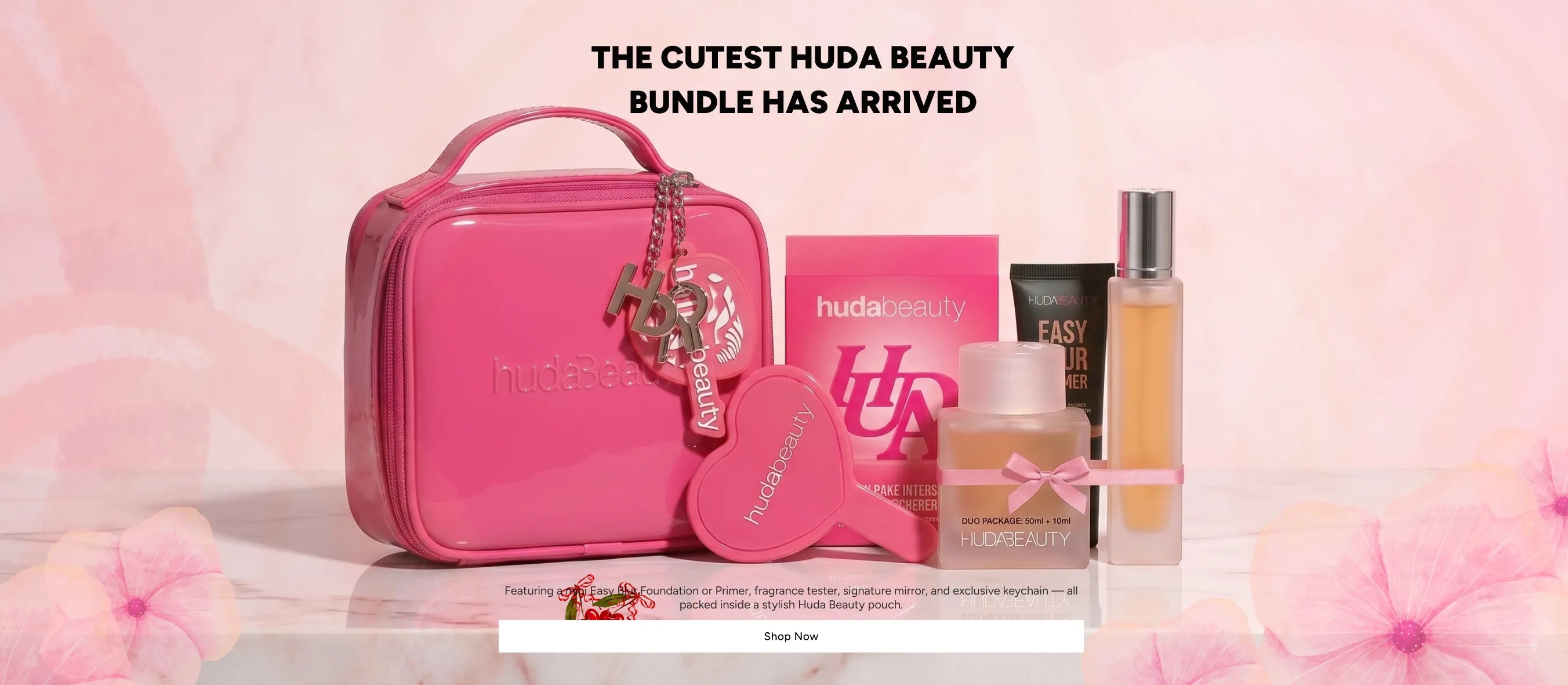 Huda Beauty Easy Bake Intense Duo bundle with mini vanity bag, Easy Blur Primer, perfume duo 50ml and 10ml, air freshener and heart mirror on marble surface – Shop Now at Zare Cosmetics Pakistan