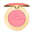 Too Faced Cloud Crush Blush in Golden Hour shade in gold compact.