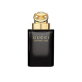 Gucci Intense Oud Eau de Parfum black luxury fragrance bottle with gold cap and elegant gold lettering.