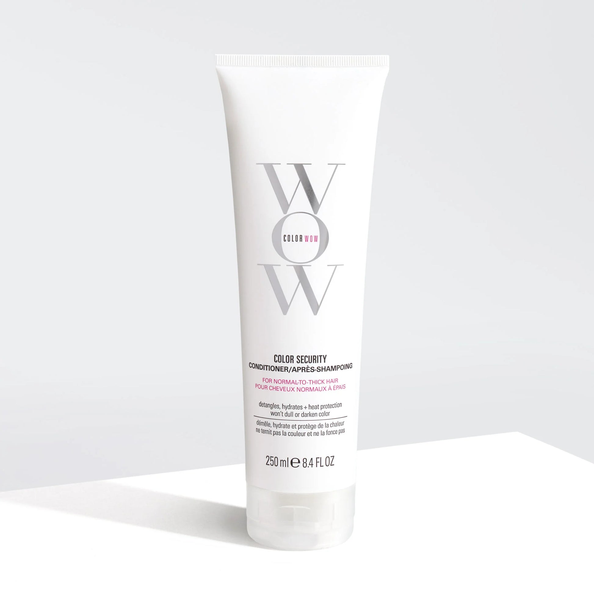 Color Wow Color Security Conditioner for Normal to Thick Hair 250ml bottle with clean white packaging showing before and after of smooth, shiny, frizz-free hair transformation