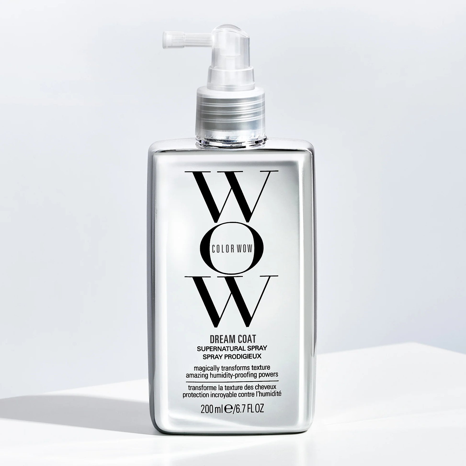 Color Wow Dream Coat Supernatural Spray bottle on clean background with sleek straight frizz-free glossy hair showing humidity-proof glass hair transformation before and after effect
