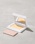 Fenty Beauty Bright Fix Powder in Banana compact.