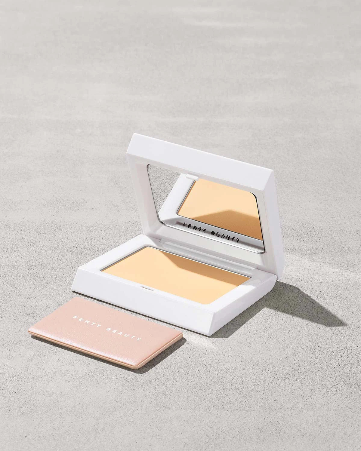 Fenty Beauty Bright Fix Powder in Banana compact.