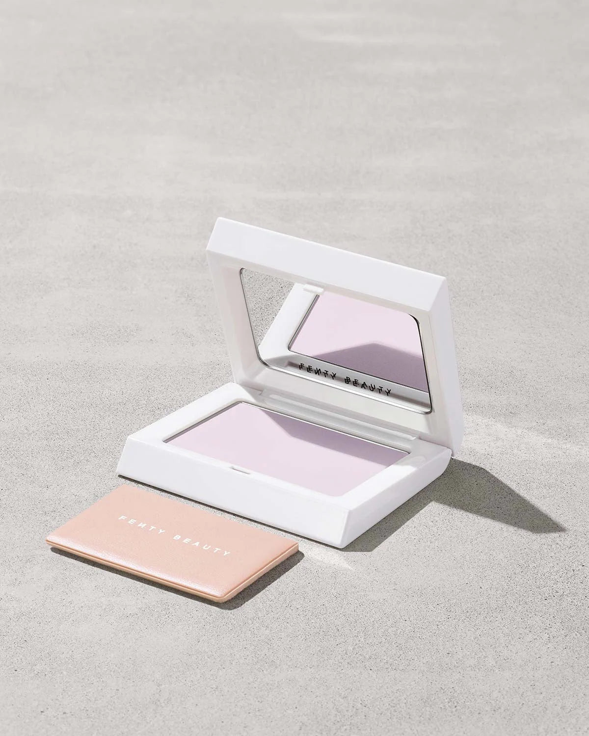 Fenty Beauty Bright Fix Powder in Lavender compact.