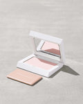Fenty Beauty Bright Fix Powder in Rose Quartz compact.