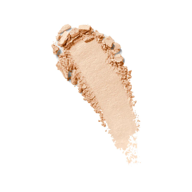 Kylie Cosmetics Kylighter illuminating powder highlighter texture swatch in a light gold shade isolated at ZARÉ Cosmetics