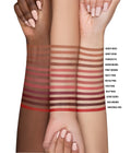 Arm swatches of all 12 Huda Beauty Lip Contour 2.0 shades on three skin tones, from Sandy Beige and Pinky Brown to Muted Pink, Deep Rose and Universal Red