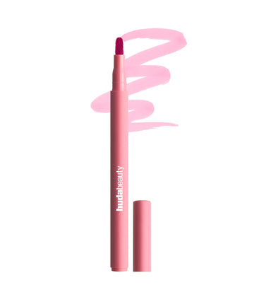 Huda Beauty Lip Contour matte lip liner pencil in Rosewood with a textured color smudge stroke at ZARÉ Cosmetics