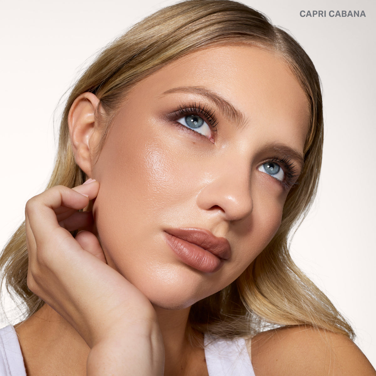 Model wearing the Morphe Cheek Thrills Bronze & Tone Duo in Capri Cabana with a sun-kissed bronze glow