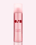 ONE/SIZE On ‘Til Dawn pink matte setting spray bottle with bold red branding, shown on glossy red background representing waterproof long-wear makeup lock and oil-control finish