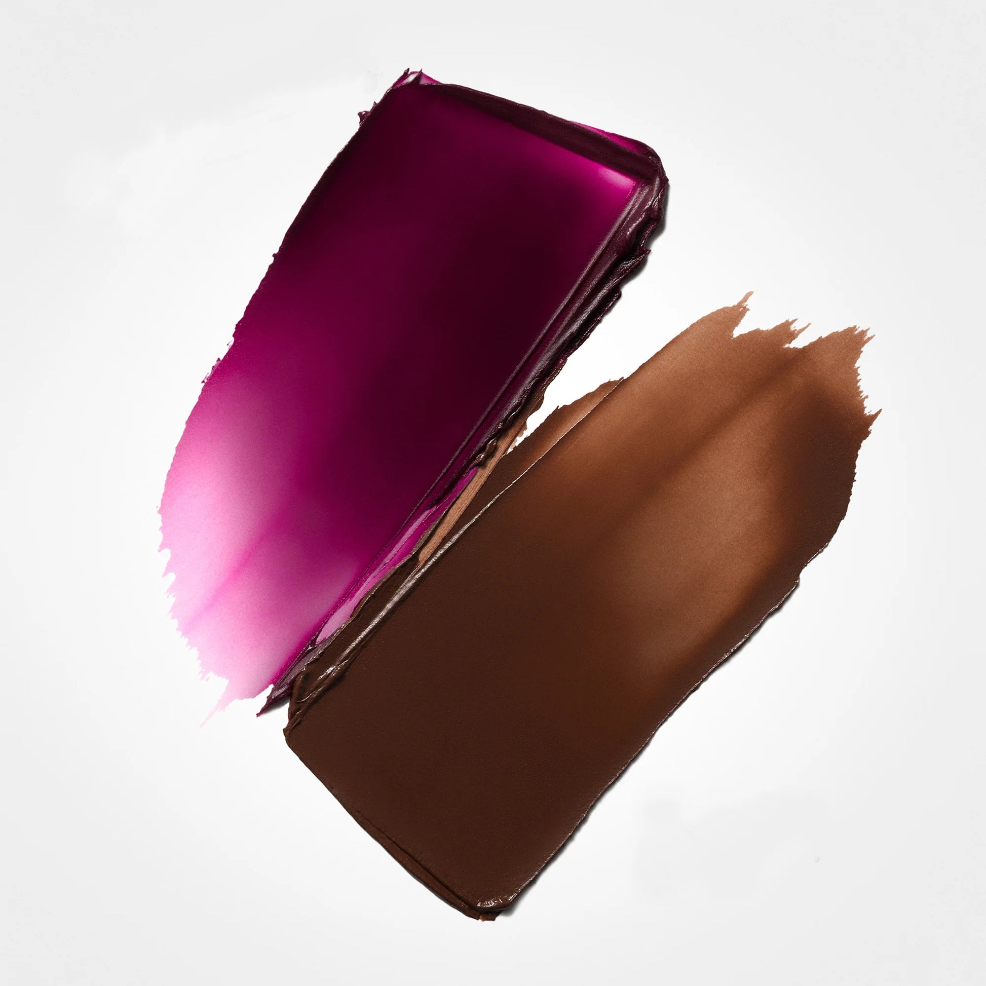 Stila dual-ended stick product swatches in plum blush and deep contour shades isolated on white at ZARÉ Cosmetics