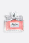 Miss Dior Parfum by Dior luxury women's fragrance bottle with pink perfume and signature silver bow on a soft grey background.