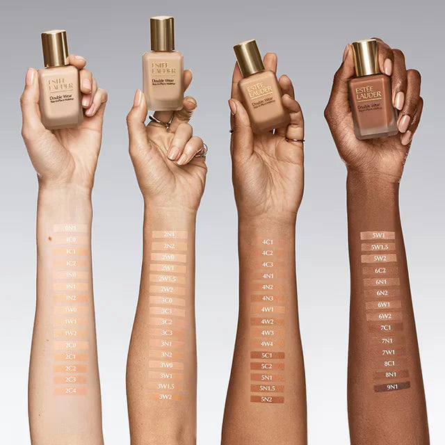 Four diverse skin tone arms with Estée Lauder Double Wear foundation shade swatches and labels at ZARÉ Cosmetics