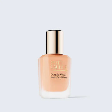 Estée Lauder Double Wear Stay-in-Place liquid foundation bottle with a gold cap isolated on ZARÉ Cosmetics.