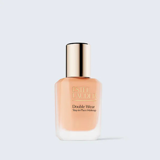 Estée Lauder Double Wear Stay-in-Place liquid foundation bottle with a gold cap isolated on ZARÉ Cosmetics.
