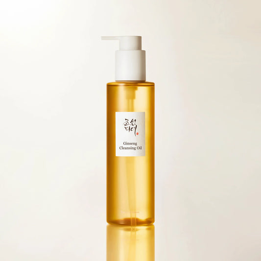 Close-up product shot of Beauty of Joseon Ginseng Cleansing Oil bottle with pump, minimal studio lighting and soft reflection base.