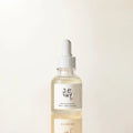 Product bottle of Beauty of Joseon Glow Deep Serum Rice + Alpha-Arbutin with minimal studio lighting and soft reflection surface.