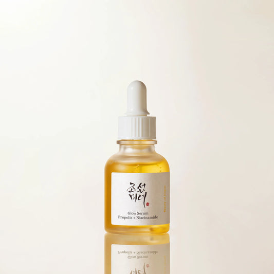 Beauty of Joseon Glow Serum Propolis + Niacinamide bottle with golden liquid dropper, highlighting pore care and skin glow benefits in a clean minimal skincare aesthetic