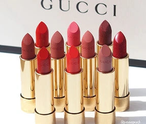 Gucci Rouge à Lèvres matte lipstick collection featuring red, pink, and nude shades in gold tubes on ZARÉ Cosmetics