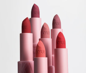 Kylie Cosmetics matte lipstick collection featuring red, coral, and mauve shades in pink tubes on ZARÉ Cosmetics