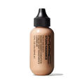 MAC Studio Radiance Face and Body Foundation shade N1 on black background.