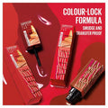 Maybelline Super Stay Vinyl Ink Sauce tubes and doe-foot applicator on a red background with the claim colour-lock formula, smudge and transfer proof