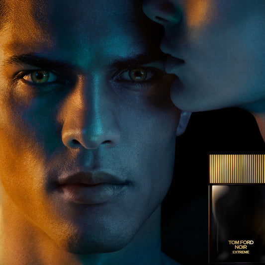 Tom Ford Noir Extreme campaign banner featuring models with dramatic lighting and a perfume bottle at ZARÉ Cosmetics