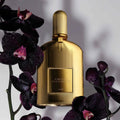 Tom Ford Black Orchid Parfum 50ml gold bottle styled with dark purple orchids and dew drops at ZARÉ Cosmetics