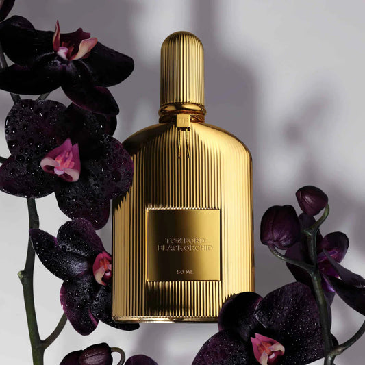 Tom Ford Black Orchid Parfum 50ml gold bottle styled with dark purple orchids and dew drops at ZARÉ Cosmetics