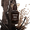 Tom Ford Vanille Fatale perfume bottle with vanilla pods, roasted barley, and dark wood styling.